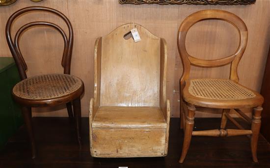 A 19th century pine childs rocking chair and two later cane seat childs chairs